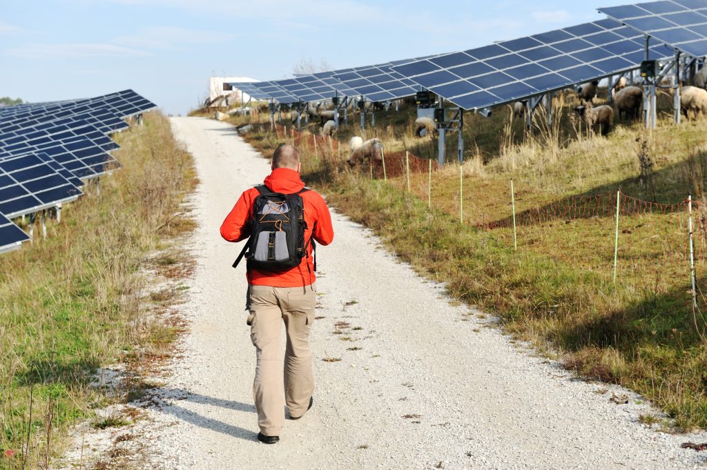 man walking on a countryside road BFihtprj