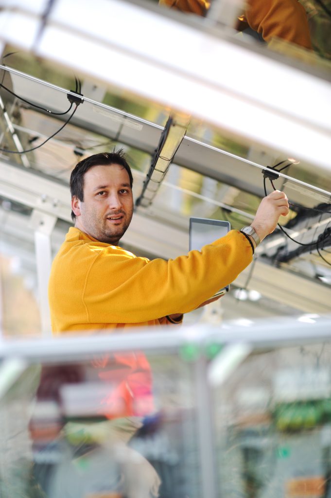 young expert working at solar panels rtfcT86Hj